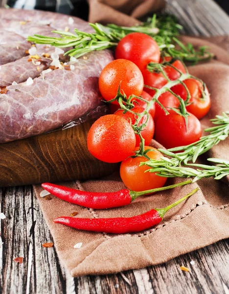 Red hot chili pepper on a wooden table with spices, selective focus — Stock Photo, Image