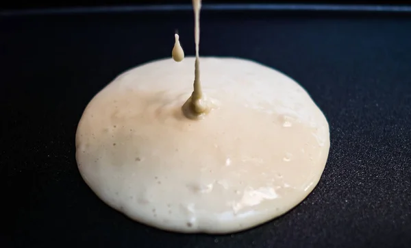 Making pancake with pancake mix