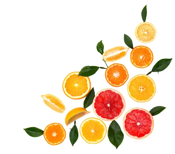 Isolated citrus fruits. Pieces of lemon, lime, pink grapefruit and orange isolated on white background, with clipping path. Top view — Stock Photo, Image