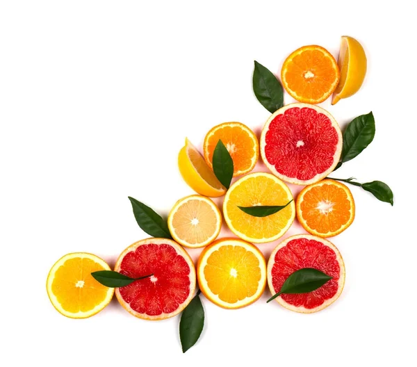 Isolated citrus fruits. Pieces of lemon, lime, pink grapefruit and orange isolated on white background, with clipping path. Top view — Stock Photo, Image