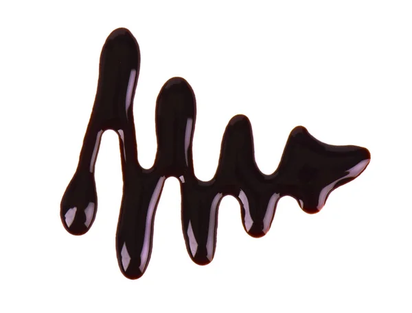 Sciroppo di cioccolato goccia isolato su sfondo bianco. Vista dall'alto . — Foto Stock
