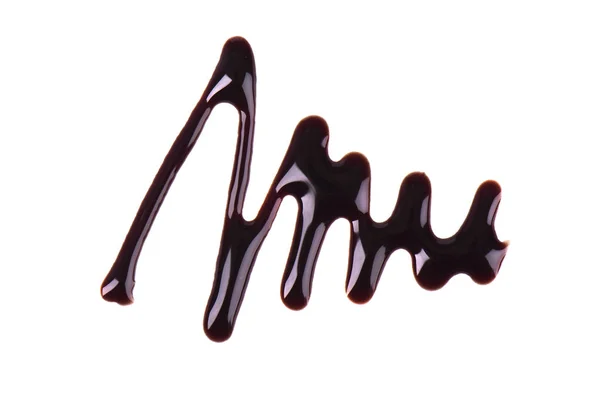 Chocolade siroop drop geïsoleerd op witte achtergrond. Bovenaanzicht. — Stockfoto