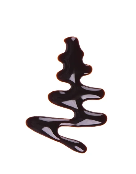 Gota de jarabe de chocolate aislado sobre fondo blanco. Vista superior . — Foto de Stock