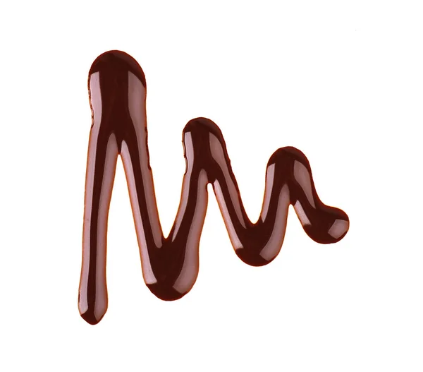 Chocolade siroop motregen geïsoleerd op witte achtergrond. Stukjes zoete chocoladesaus. Bovenaanzicht. — Stockfoto