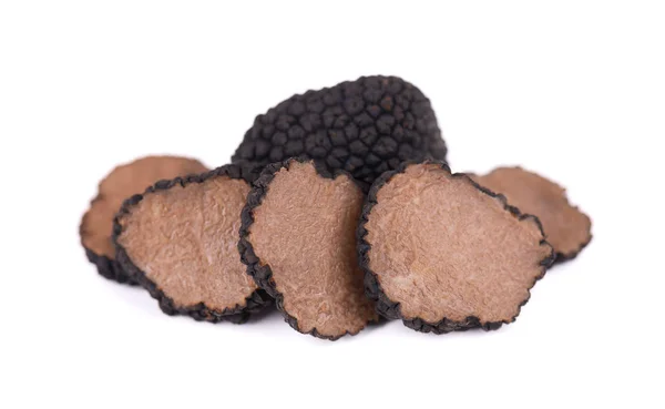 Black truffles isolated on a white background. Fresh sliced truffle. Delicacy exclusive truffle mushroom. Piquant and fragrant French delicacy. Clipping path. — Stock Photo, Image