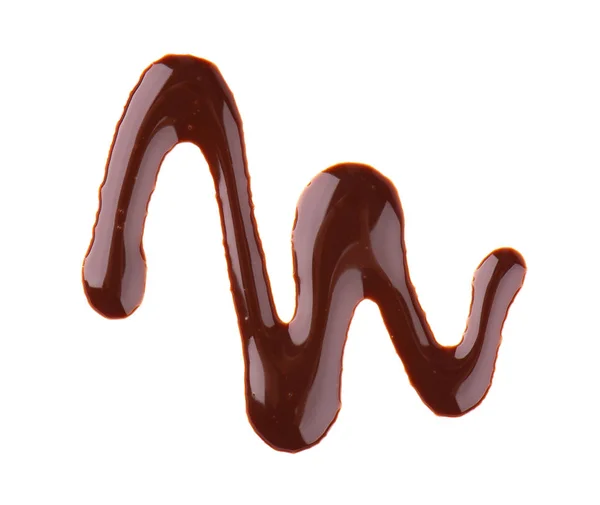 Chocolade siroop motregen geïsoleerd op witte achtergrond. Stukjes zoete chocoladesaus. Bovenaanzicht. — Stockfoto