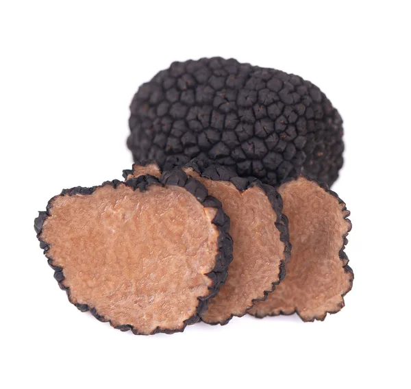 Black truffles isolated on a white background. Fresh sliced truffle. Delicacy exclusive truffle mushroom. Piquant and fragrant French delicacy. Clipping path. — Stock Photo, Image