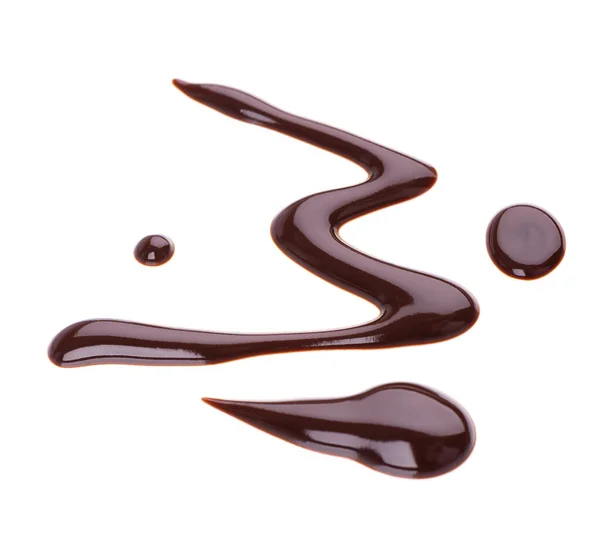 Čokoládový sirup mrholení izolované na bílém pozadí. Šplouchnutí sladké čokoládové omáčky. Horní pohled. — Stock fotografie