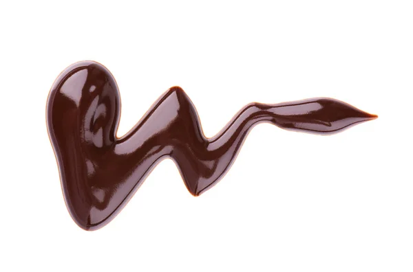 Chocolade siroop motregen geïsoleerd op witte achtergrond. Stukjes zoete chocoladesaus. Bovenaanzicht. — Stockfoto