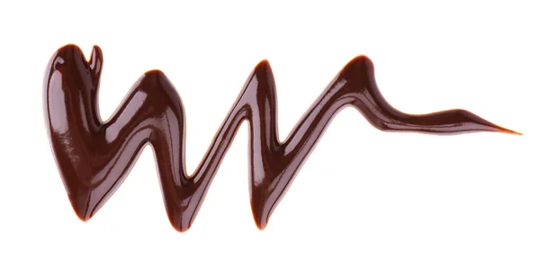 Chocolade siroop motregen geïsoleerd op witte achtergrond. Stukjes zoete chocoladesaus. Bovenaanzicht. — Stockfoto