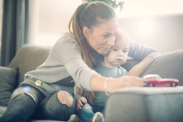 Mom and her toddler son playing together — Stock Photo, Image