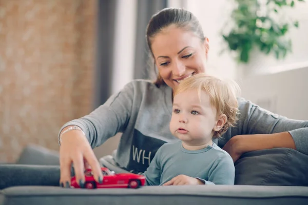 Mom and her toddler son playing together — Stock Photo, Image