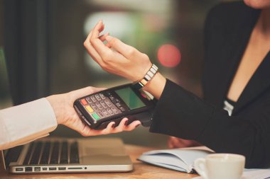 Young woman using credit card 