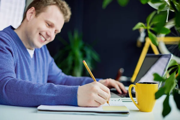 Young man in modern office — Stock Photo, Image