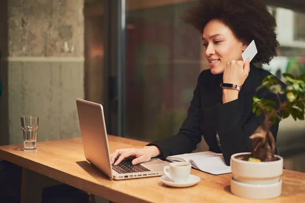 Young woman using credit card 