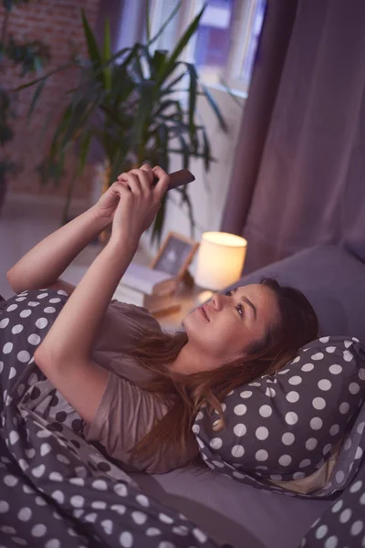 Young beautiful woman using phone — Stock Photo, Image