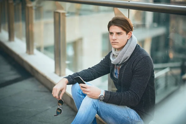 Young Man Sitting Outdoor Using Smart Phone — Stock Photo, Image