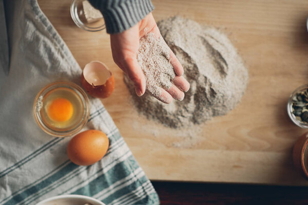 Close up of woman 's hands making a bread.