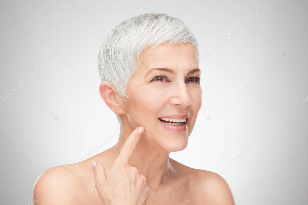 Head shot of senior woman showing wrinkles.