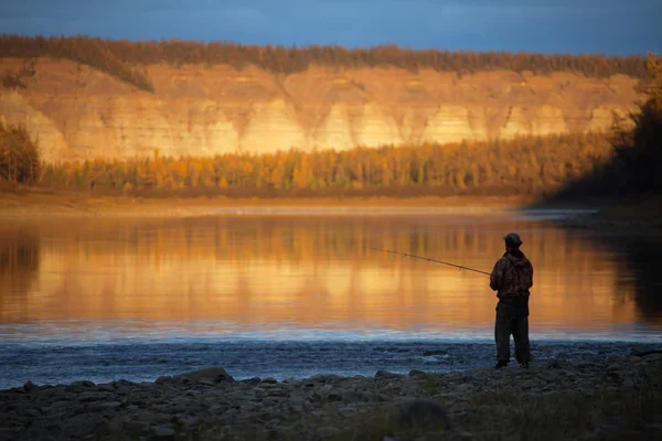 Evening fishing on the Siberian river autumn