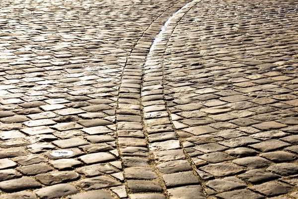 Stone paved square in bright sunlight