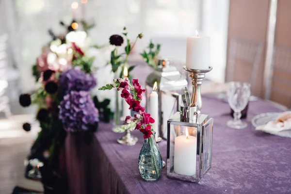 Closeup Candles Flowers Standing Festive Table Violet Cloth — Stock Photo, Image