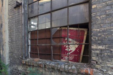 The abandoned window with the poster of Tito clipart