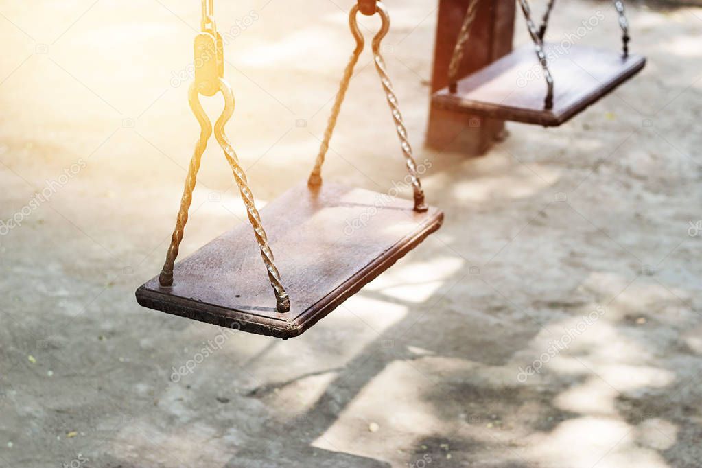 Empty metal swing in playground