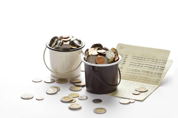 Coins in buckets and saving account passbook, book bank — Stock Photo, Image