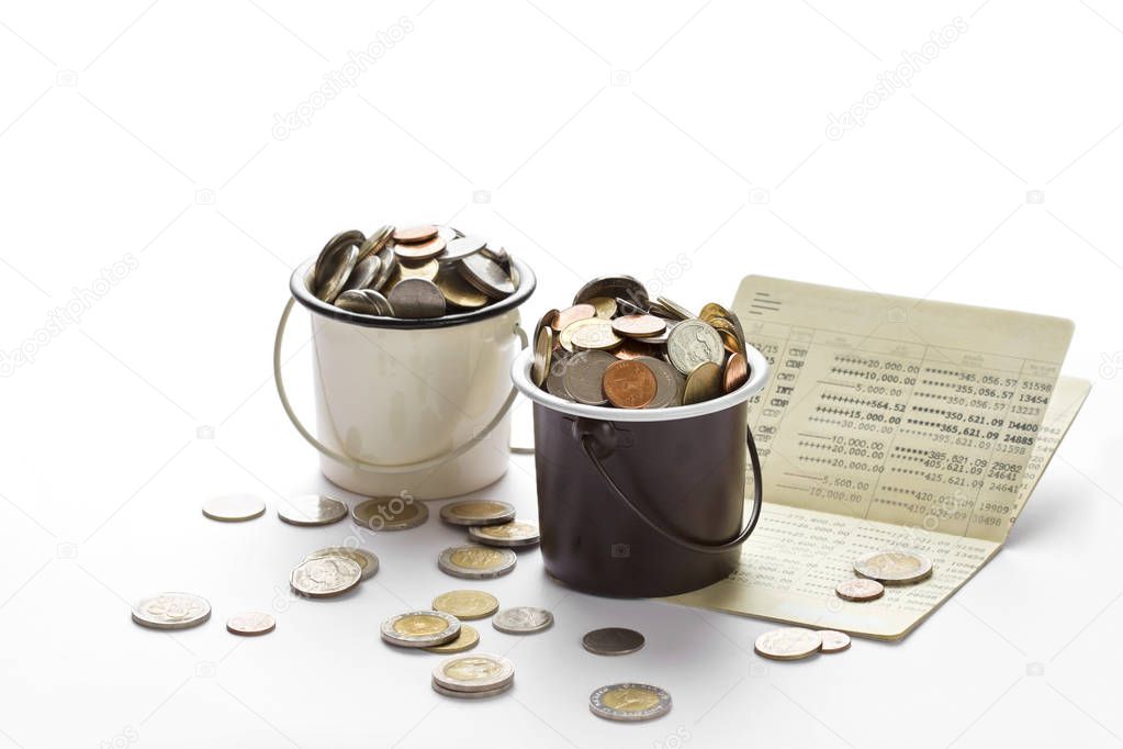 Coins in buckets and saving account passbook, book bank 