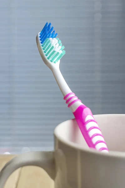 Toothbrush in the white cup — Stock Photo, Image