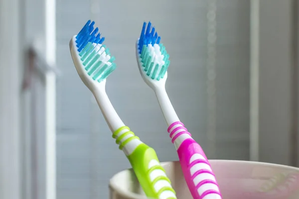 Toothbrushes in the white cup — Stock Photo, Image