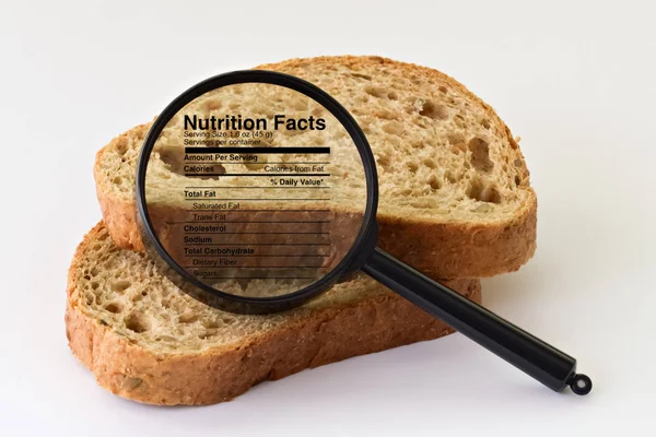 Bread under a magnifier — Stock Photo, Image