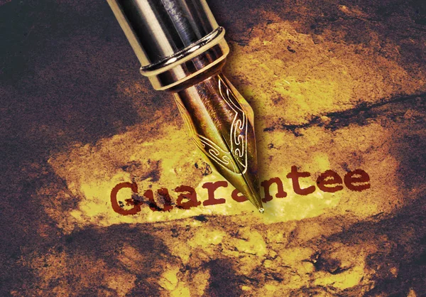 Word Guarantee and a pen — Stock Photo, Image