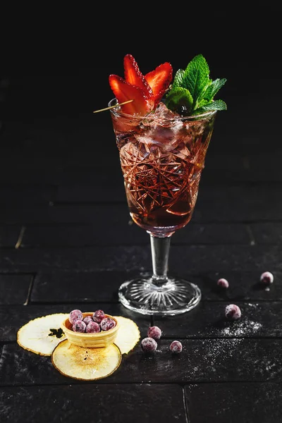 Garnished cocktail on black background — Stock Photo, Image