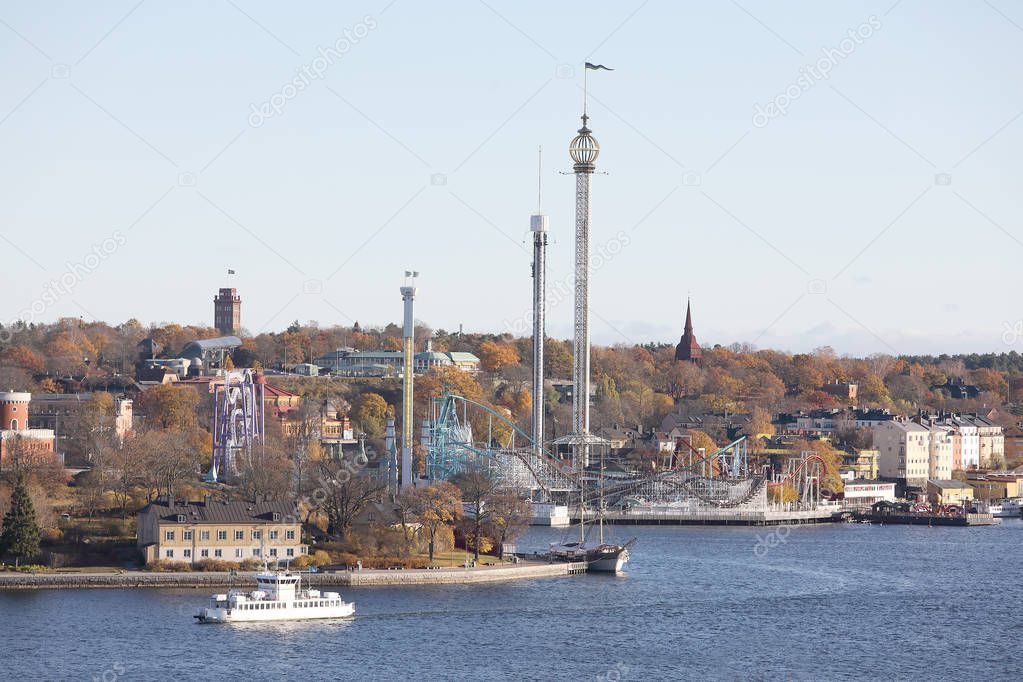 The beautiful Skeppsholmen, a ferry and the amusement park Grona Lund in central Stockholm