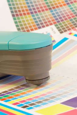 Spectrometer used for proofing on a leaf of the test print clipart