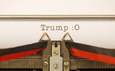 STOCKHOLM, SWEDEN - January 20, 2017: Old typewriter writes US President Donald Trump and an afraid smiley clipart
