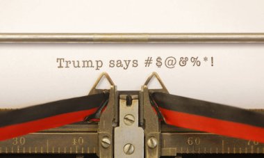 Old typewriter writes Trump profanity clipart