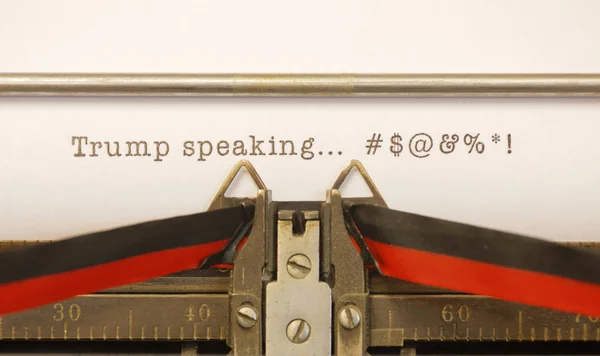 STOCKHOLM, SWEDEN - January 20, 2017: Reporter uses old typewriter to write what US President Donald Trump Donald Trump said during a press conference