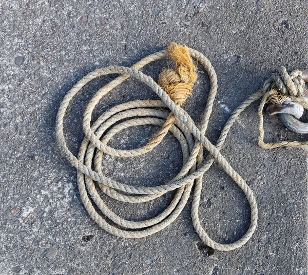 Rope made of hemp laying on the bridge — Stock Photo, Image