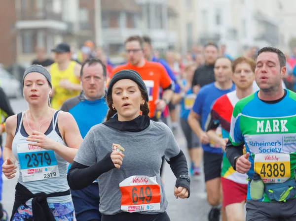 Young girl and competitors running in the Vitality Brighton half — Stock Photo, Image