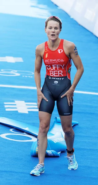 Female triathlete Flora Duffy exhausted after the finish — Stock Photo, Image