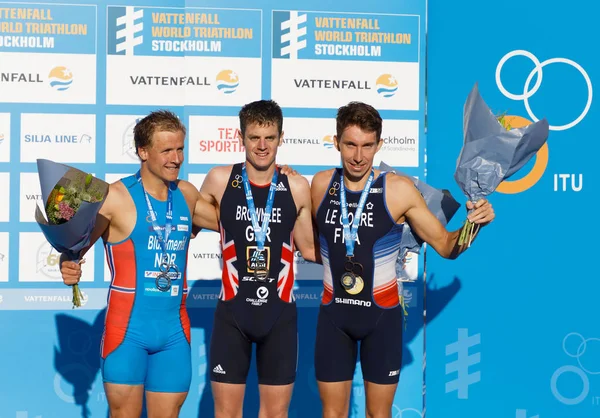 Stockholm - 26 Ağustos 2017: Jonathan Brownlee, Kristian Blummenfelt ve Pierre le Corre kazananın stand erkekler İTÜ dünya triatlon serisi olay Augist 26, 2017 Stokholm, İsveç