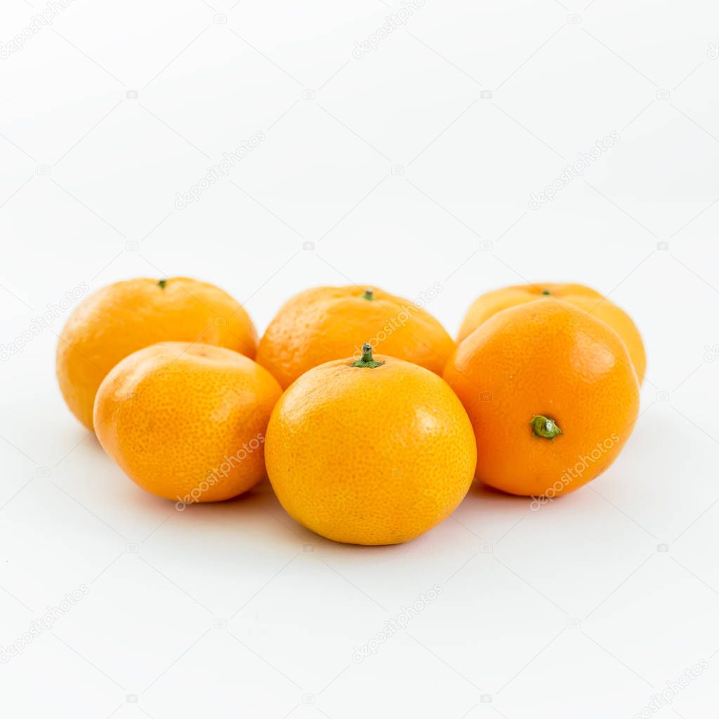heap of oranges on white