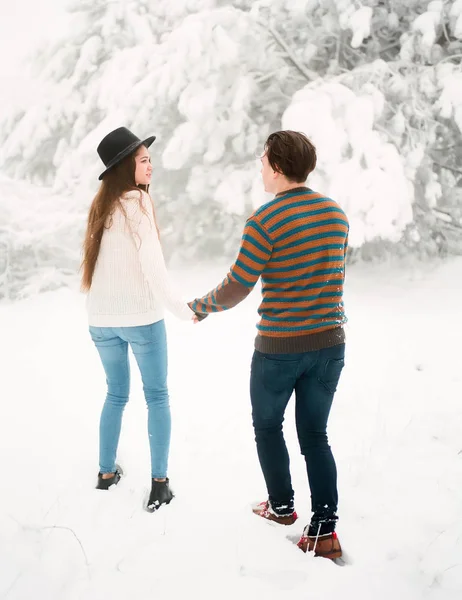 Young couple holding hands — Stock Photo, Image