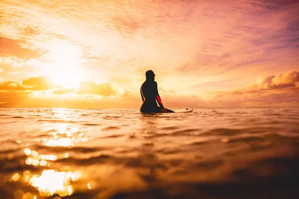 Girl sitting on   board — Stock Photo, Image