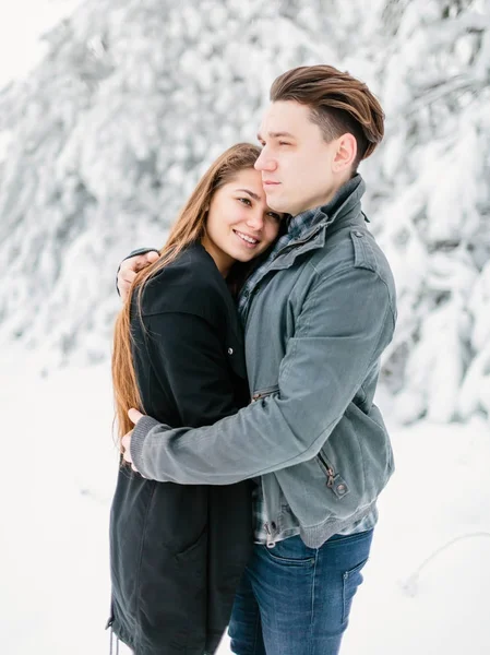 Young couple hugging in forest — Stock Photo, Image