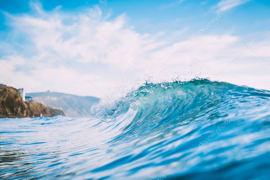 Blue wave in ocean. Clear wave and sun light
