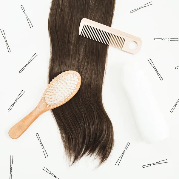 Tools for hair styling and combs on white background. Beauty composition. Flat lay, top view
